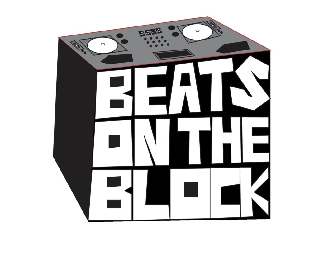 The Beats on the Block Logo is a block with dj equipment on top and beats on the block written on the front of the block